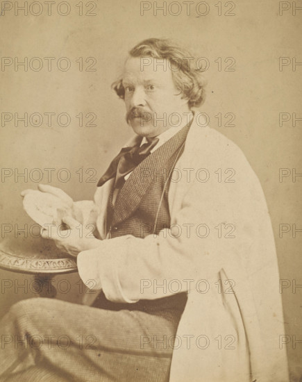 Self-portrait holding medallion commemorating his deceased mother, 1860-1861. Creator: Nadar.