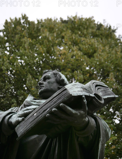 Bronze statue of Martin Luther next to the Marienkirche, (St Mary's Church), Berlin, Germany, 2025.  Creator: LTL.