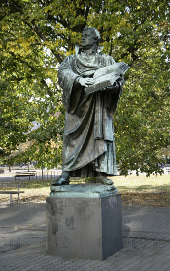 Bronze statue of Martin Luther next to the Marienkirche, (St Mary's Church), Berlin, Germany, 2025.  Creator: LTL.
