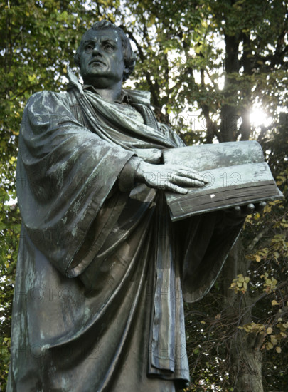 Bronze statue of Martin Luther next to the Marienkirche, (St Mary's Church), Berlin, Germany, 2025. Creator: LTL.
