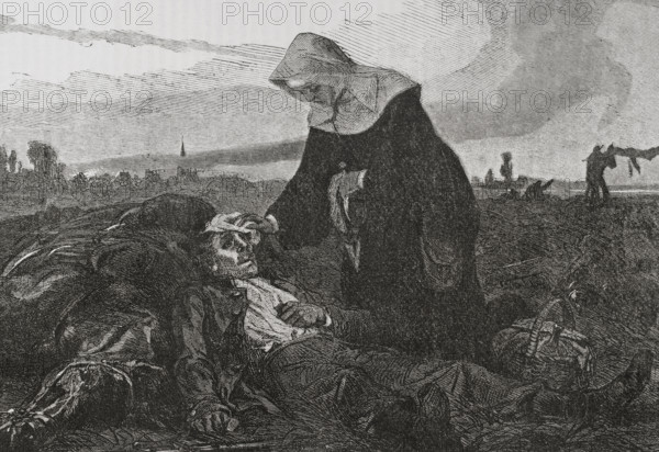 Franco-Prussian War (1870-71): Sisters of Charity on the battlefield, tending to the wounded, 1870.  Creator: Unknown.
