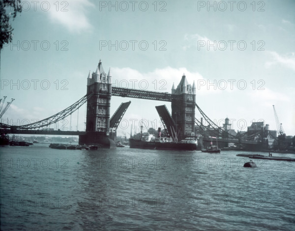Tower Bridge with bascules raised, London, c1955.  Creator: Arthur Charles Kirby Ware.