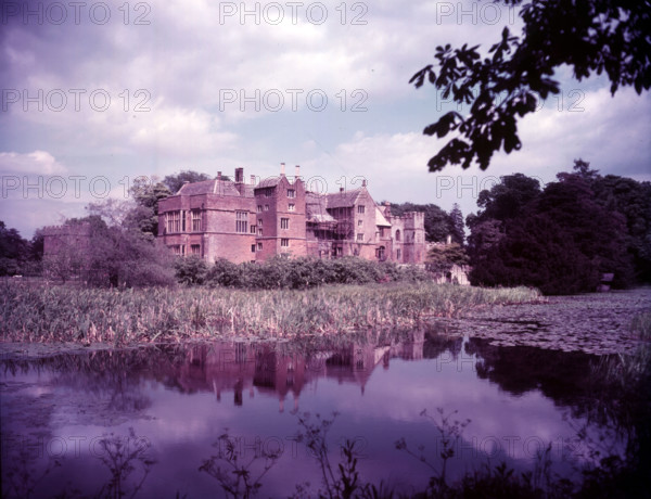 Broughton Castle and moat, Oxfordshire, c1955. [gateway, church] Creator: Arthur Charles Kirby Ware.