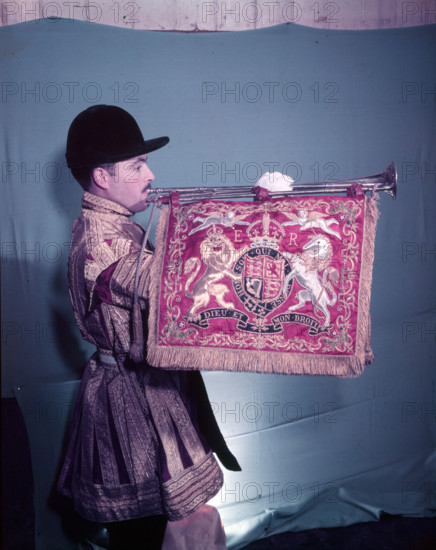 State trumpeter with 'ER' cypher on banner, side view, London, c1953. Creator: Arthur Charles Kirby Ware.