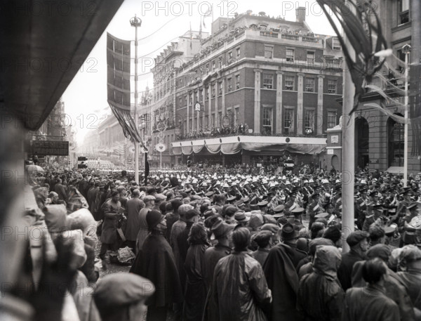 Crowds watching the coronation procession of Queen Elizabeth II, Oxford Street, London, 2 June 1953. Creator: Arthur Charles Kirby Ware.