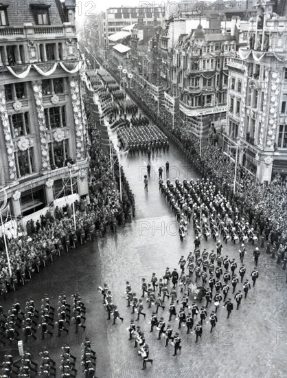 Crowds watching the coronation procession of Queen Elizabeth II, Oxford Circus, London, 2 June 1953. Creator: Arthur Charles Kirby Ware.