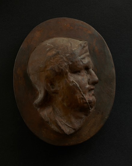 Cast of head of Roman soldier in helmet with bulging brow. Creator: Unknown.