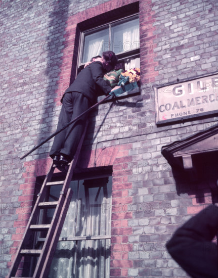 Tutti Man claiming a kiss, Hocktide Festival, Hungerford, Berkshire, c1955. Creator: Arthur Charles Kirby Ware.
