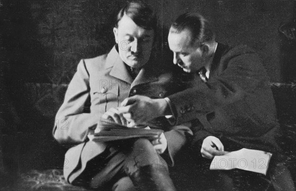 Chief of Reich press division submitting press reports to Hitler