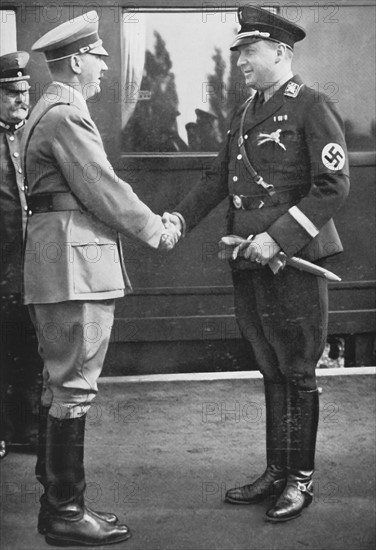 Hitler greeting his minister Darré, 1934