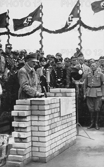 Hitler laying the first stone of a common house in the Schleswig-Holstein region (1935)