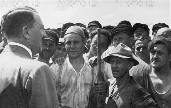 Hitler greeting a group of workers, 1934