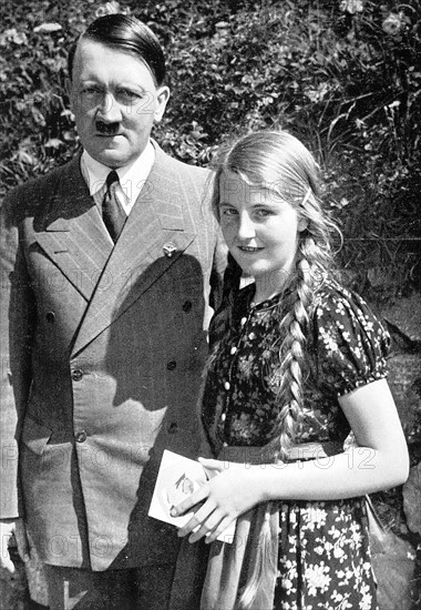 Hitler photographed with a young German girl, 1935