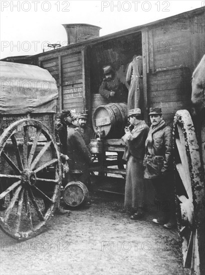 French soldiers are given wine on the front