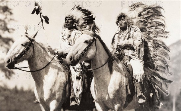 Stoney Indian and Squaw on horseback