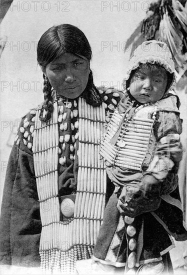 Mrs Hiron Bull and son, at the Red Indian village in the  Zoological Garden of Paris.