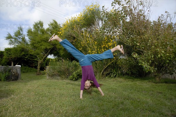 Girl making sport in a garden