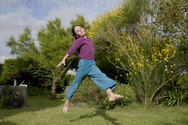 Girl making sport in a garden