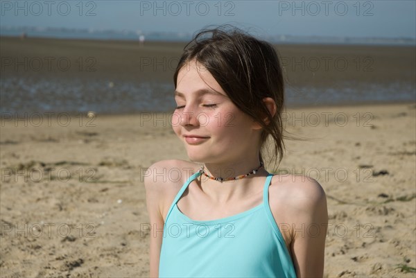 Girl laying on sand