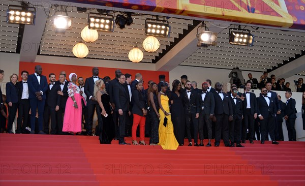 Ladj Ly, Damien Bonnard with the crew of the film 'Les Misérables'