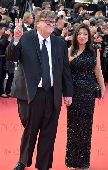 Michael Moore with his wife
