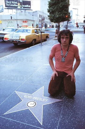 Michel Sardou on Hollywood Boulevard in front of the King's star