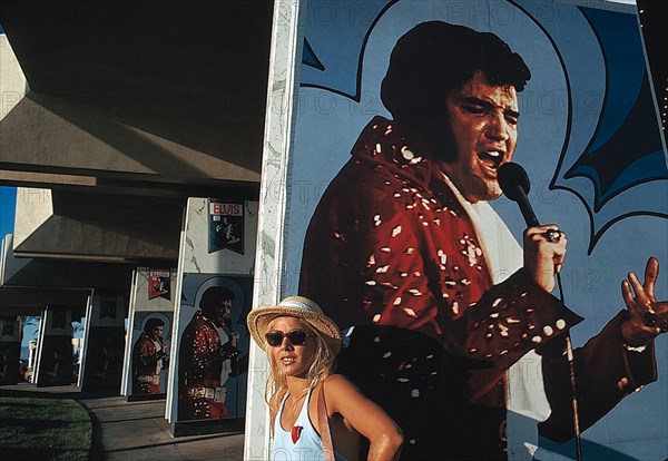 Sylvie Vartan in front of an Elvis Presley  poster