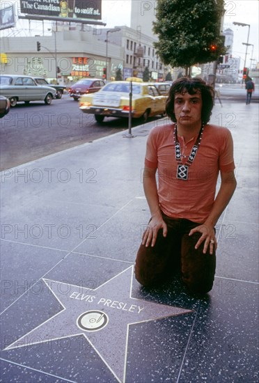 Michel Sardou on Hollywood Boulevard in front of the King's star