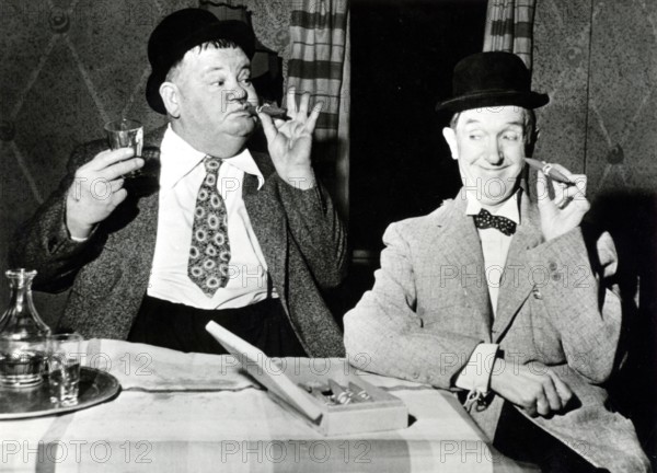 Stan LAUREL and Oliver HARDY with cigars
