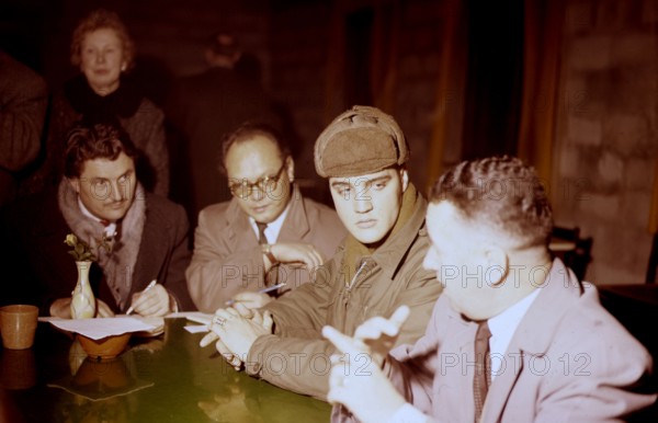 Elvis PRESLEY as a soldier during a press conference, 1958