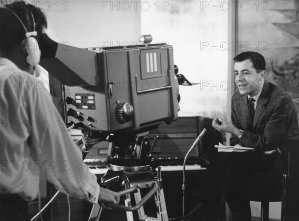 Chris HOWLAND in front of a television camera, undated