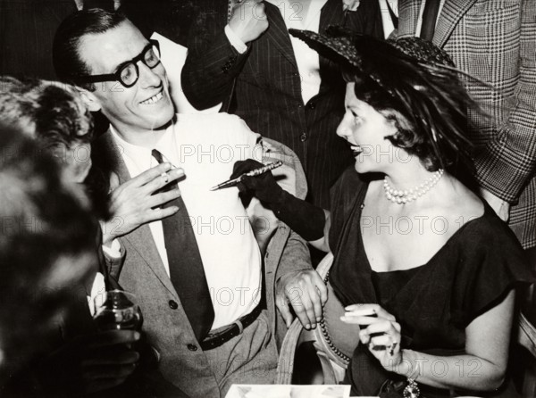 Rita HAYWORTH gives autograph