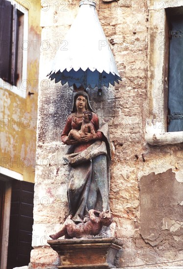 Virgin and child above the devil