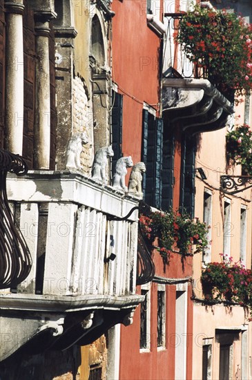 Detail of a façade in Venice, balcony with four lions