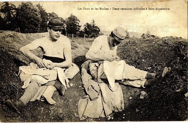 Couple of 'Poilus' taking out their lice in the Trench