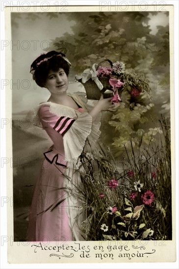 Postcard with a woman holding a basket of flowers
