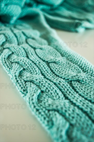 Green knitted sweater texture background, sweater sleeve, pattern detail