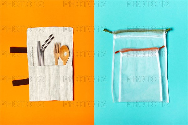Set of reusable items for an eco-friendly lifestyle. Eco bags, metal tubes, wooden fork and spoon. Zero waste concept, plastic-free, organic, eco-friendly shopping