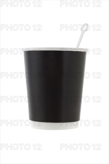 Disposable paper coffee cup with stirrer on white background