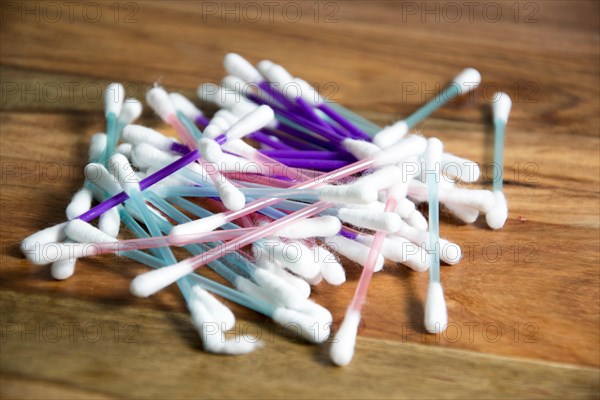 cotton swabs on wooden background