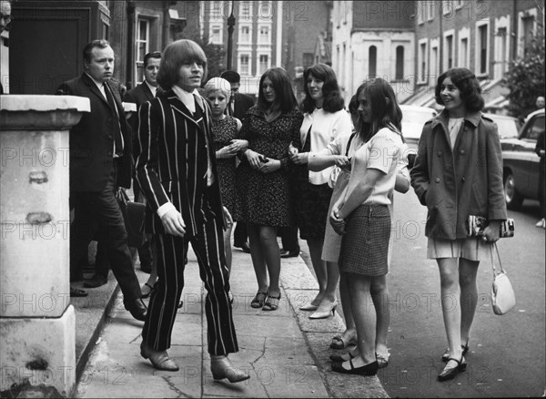 Jun. 06, 1967 - Brian Jones of the Rolling Stones' Faces Drug Charge at West London Court: Brian Jones. the 25-year-old guitarist with the ''Rolling Stones' pop group and Prince Stanislas Klossowski De Rowla, Baron De Watteville, appeared together on drug charges at the West London Court today. They elected to go for trial Photo shows Brian Jones seen after the hearing in London today watched by some mini-skirted girls. (Credit Image: Â© Keystone Press Agency/Keystone USA via ZUMAPRESS.com)