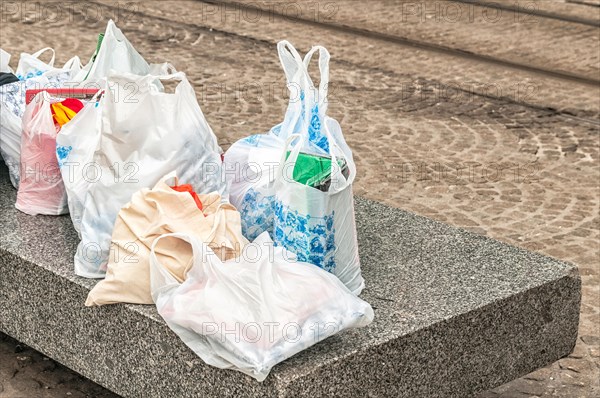 plastic bags lying on a concrete block