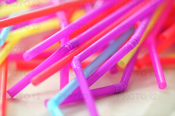 Banning plastic straws enviromental concerns concept, macro close up selective focus.