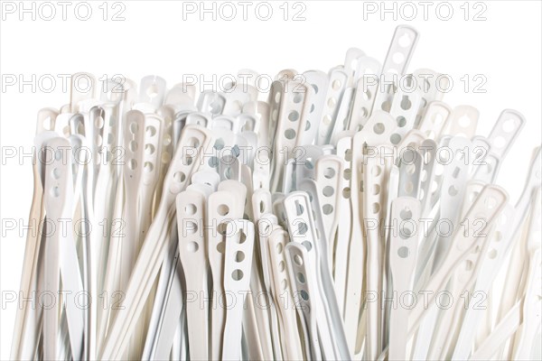 plastic sticks for stirring hot drinks isolated on white background