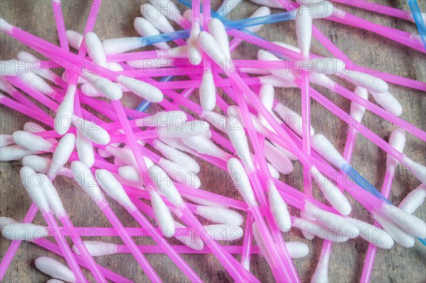 Ear buds or Cotton swabs used for cleaning ears kept on a textured grey table