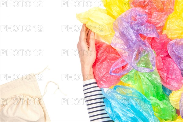 Woman refuses single use plastic bags and choose reusable shopping bag. No plastic, environmental, pollution concept