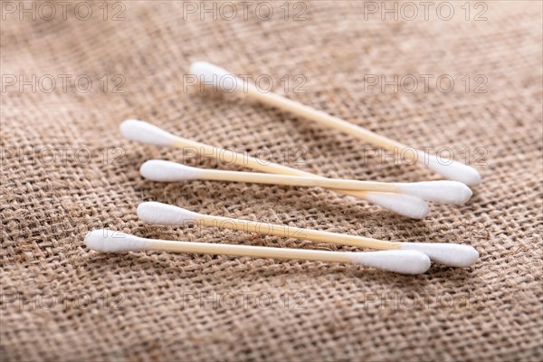 Close-up Of Wooden Cotton Buds Over The Sack Cloth