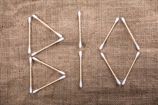 High Angle View Of Bio Text Written With Wooden Cotton Buds Over Jute Cloth