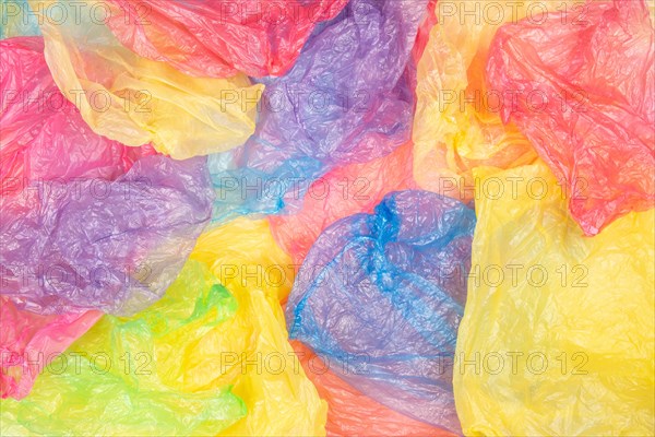 Multicolored single use plastic shopping bags background