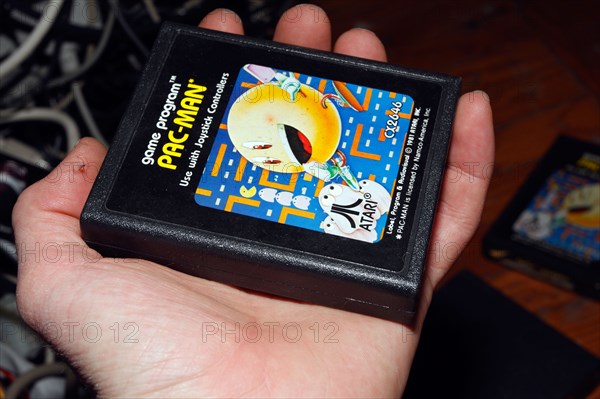 Hand and PacMan Pac-man console game cartridge for Atari.